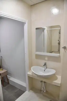 a bathroom with a sink and a mirror at Athens Zeus A by Super Host Hub in Athens