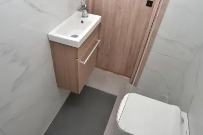 a bathroom with a sink and a toilet at Διαμέρισμα δίπλα από την θάλασσα in Athens