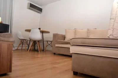 a living room with a couch and a table at Διαμέρισμα δίπλα από την θάλασσα in Athens