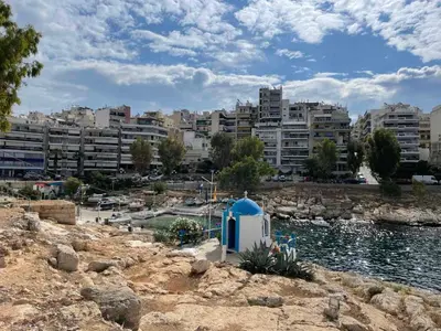 a view of a city with buildings and a body of water at Piraiki Coastal Accommodation in Piraeus