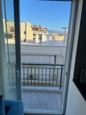 a view of a balcony from a window at Exzellent ApartAthens 120qm, near Metro M2 in Athens