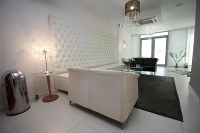 a living room with a couch and a table at X Dream Hotel-Adults Only in Athens