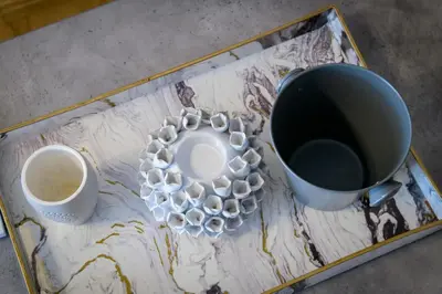 a tray with two cups and a tea set on a table at Cosy 2BR flat near Ampelokipoi station & hospitals in Athens