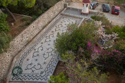 an overhead view of a garden with a bench at Saronicos Gulf View in Anavissos in Anavissos