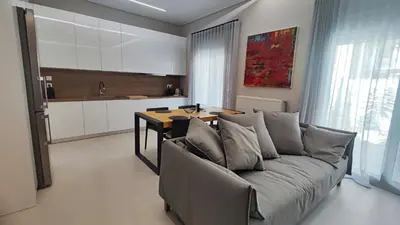 a living room with a couch and a table at Luxury Apartment Stella in Piraeus