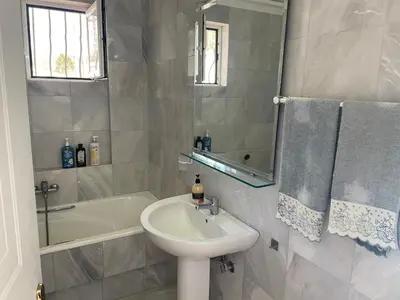 a bathroom with a sink and a toilet and a tub at Eagles Nest Villa Athenian Riviera in Aghia Marina near Lagonisi, next to the beach close to Athens Airport in Aghia Marina