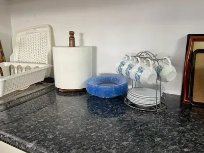 a kitchen counter with plates and utensils on it at Eagles Nest Villa Athenian Riviera in Aghia Marina near Lagonisi, next to the beach close to Athens Airport in Aghia Marina