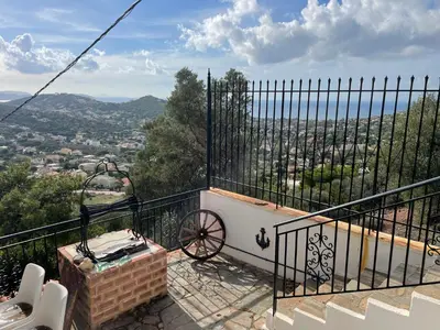 a balcony with a view of a city at Eagles Nest Villa Athenian Riviera in Aghia Marina near Lagonisi, next to the beach close to Athens Airport in Aghia Marina