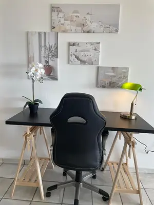 a black office chair sitting at a desk at Eagles Nest Villa Athenian Riviera in Aghia Marina near Lagonisi, next to the beach close to Athens Airport in Aghia Marina
