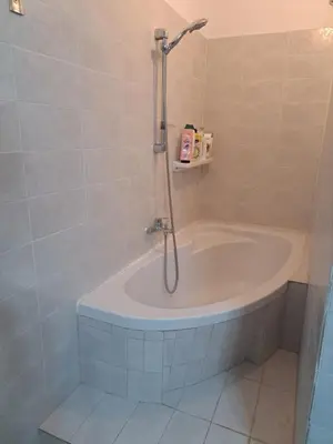a bathroom with a bath tub with a shower at dreamcatcher in Anavissos