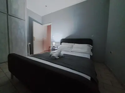 a bedroom with a large bed with white pillows at dreamcatcher in Anavissos