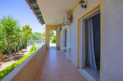 a balcony of a house with a walkway at dreamcatcher in Anavissos