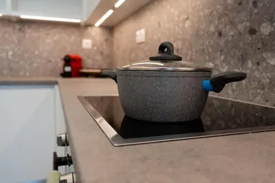 a black pot on a counter in a kitchen at LIV - Paradise Retreat in Athens in Athens