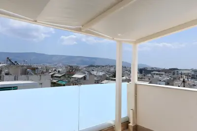 a balcony with a view of a city at LIV - View and the City Studio in Athens in Athens