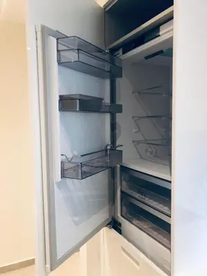 a refrigerator with its door open with its shelves at SeaRenity Glyfada Ctr, 1BR, Renovated, near beach in Athens