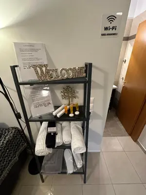 a towel rack in a bathroom with towels at Elegant Escapes 5 in Athens