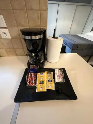 a counter top with a black tray with a blender at Elegant Escapes 5 in Athens