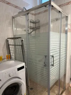 a washer and dryer in a laundry room at Elegant Escapes 3 in Athens
