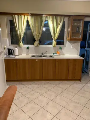 a kitchen with a sink and a window at Elegant Escapes 3 in Athens