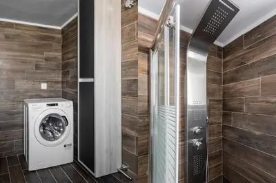 a laundry room with a washer and dryer at Radiant 2BR Apartment in Neo Psichiko by UPSTREET in Athens