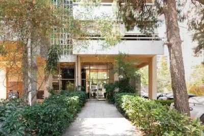 a building with a walkway in front of it at Radiant 2BR Apartment in Neo Psichiko by UPSTREET in Athens