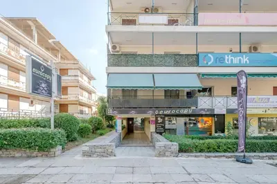 an empty street in front of a building at Boutique10 Luxury Apartment in Athens