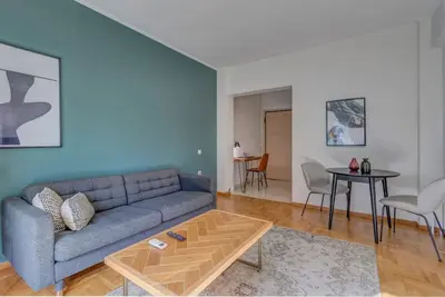 a living room with a couch and a table at Boutique10 Luxury Apartment in Athens