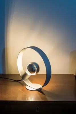 a white and blue lamp sitting on top of a table at V.L.A Apartments by the sea in Vari