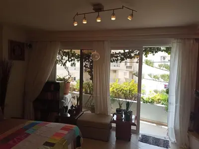 a bedroom with a bed and a large window at Annitas luxury oasis appartment in Athens