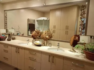 a bathroom with two sinks and a large mirror at Annitas luxury oasis appartment in Athens