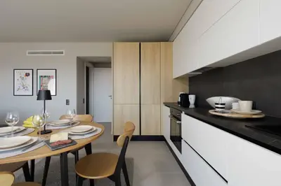 a kitchen and dining room with a table and chairs at Sunshine Suite by Athens Riviera Suites in Saronida
