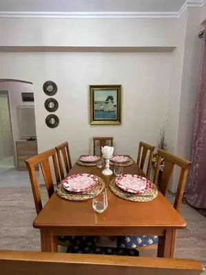 a dining room table with two plates on it at Frankie's House in Athens
