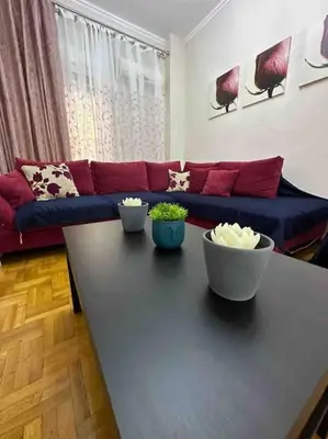 a living room with a couch and a table at Frankie's House in Athens