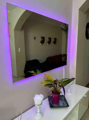 a room with a mirror and a plant on a counter at Frankie's House in Athens