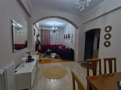 a living room with a couch and a table at Frankie's House in Athens