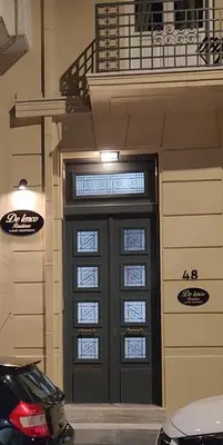 a black door with windows in a building at De lenco Residence 2 in Athens