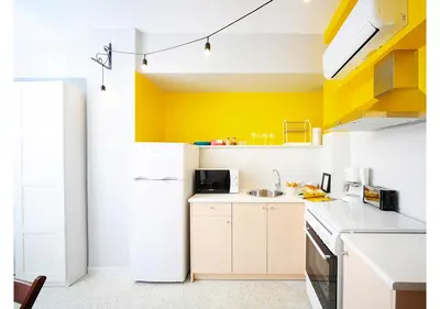 a kitchen with a white refrigerator and a sink at Live in Athens, PSYRRI Central Apartments in Athens