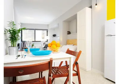 a kitchen with a white table and two chairs at Live in Athens, PSYRRI Central Apartments in Athens