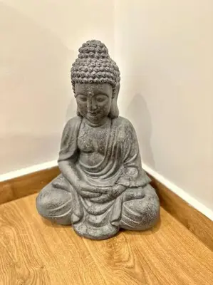 a statue sitting on the floor in a room at Relax Home In Moschato 2 VIPGreece in Piraeus