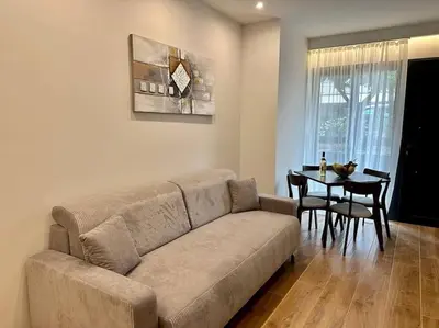 a living room with a couch and a table at Relax Home In Moschato 2 VIPGreece in Piraeus