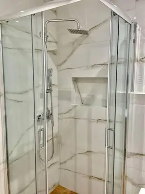 a shower with a glass door in a bathroom at Relax Home In Moschato 2 VIPGreece in Piraeus