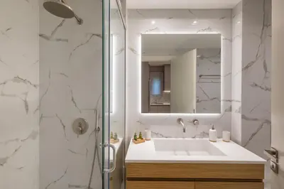 a bathroom with a sink and a mirror at Amazing Stay in Athens