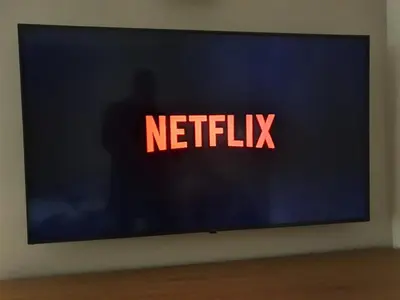 a television screen with the netflix sign on it at Amazing Stay in Athens
