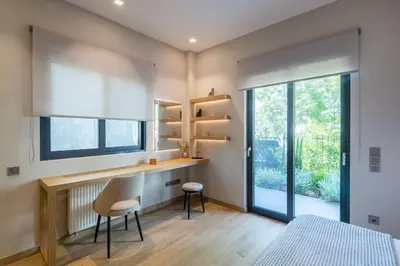 a bedroom with a desk and a bed and a window at Amazing Stay in Athens