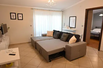 a living room with a couch and a table at Vasiliki’s Guesthouse in Athens