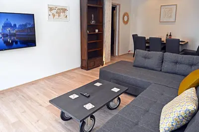 a living room with a couch and a table at Sea Luxury Apartments in Piraeus