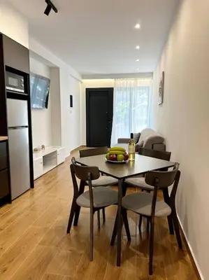 a kitchen and a dining room with a table and chairs at Moschato New Home 3 VIPGreece in Piraeus