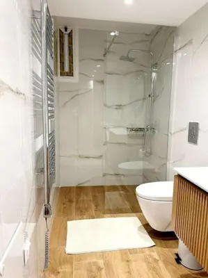 a bathroom with a glass shower and a toilet at Moschato New Home 3 VIPGreece in Piraeus