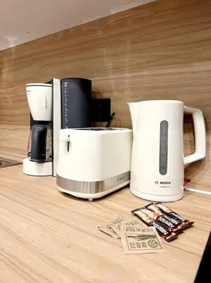 a counter with two coffee machines on a table at Moschato New Home 3 VIPGreece in Piraeus