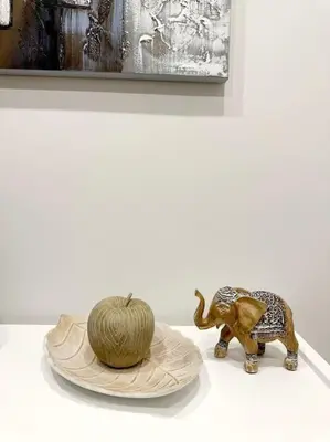 a statue of an elephant and a melon on a plate at Moschato New Home 3 VIPGreece in Piraeus